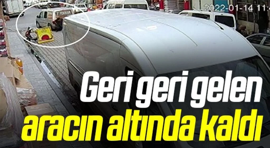 Geri geri gelen aracın altında kaldı