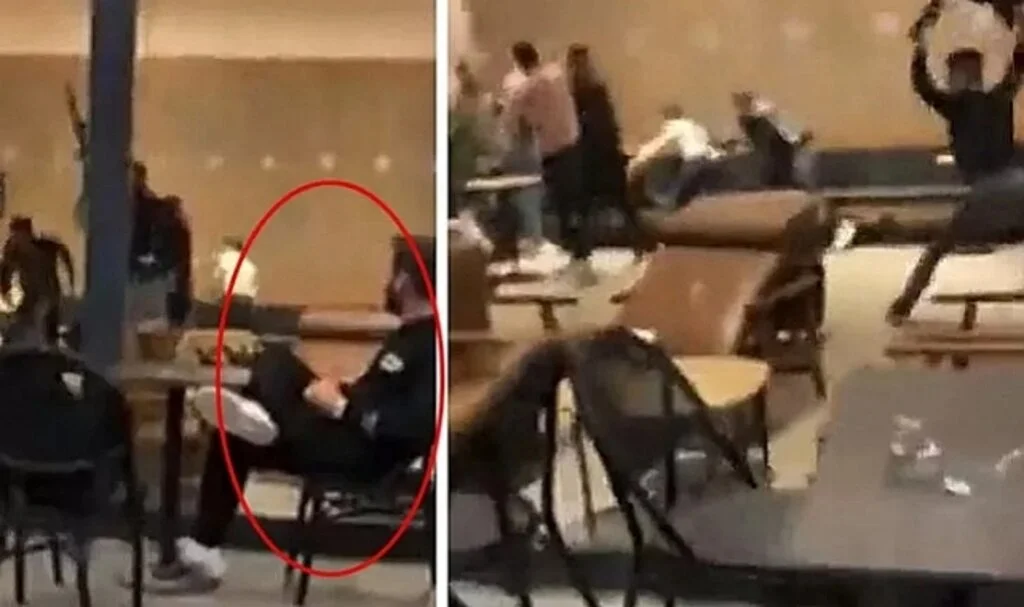Kafede çıkan kavgada masa ve sandalyeler havada uçuştu! Bacak bacak üstüne atıp kavgayı izleyen adam gündem oldu