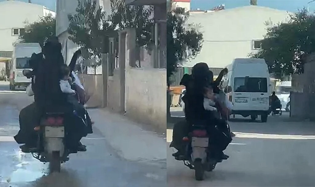 Eline serum takılı çocuğunu elektrikli bisikletle taşıdı