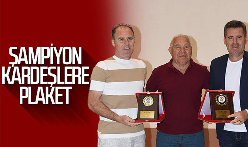Şampiyon Eroğlu kardeşlere plaket