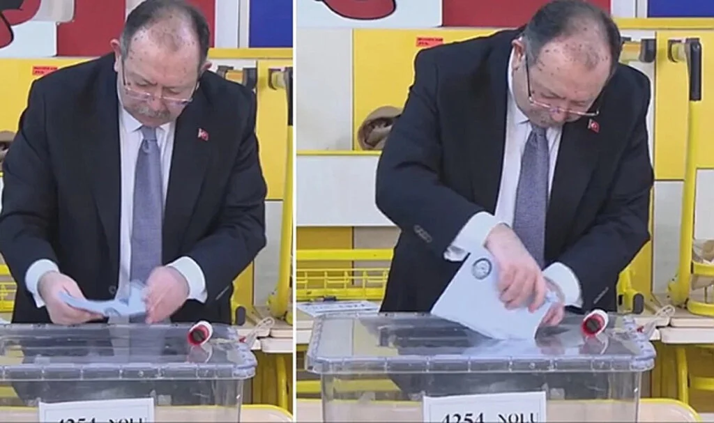 YSK Başkanı Yener, oy pusulalarının uzunluğu nedeniyle sandığa zarfı atarken güçlük çekti