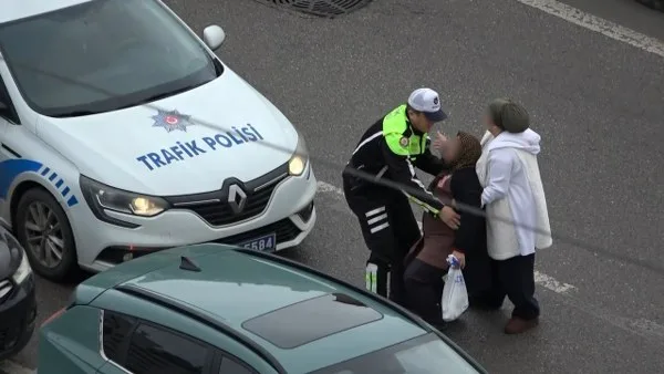 Samsun'da polisten yürek ısıtan hareket: Yaralı kadını yağmurdan korudu